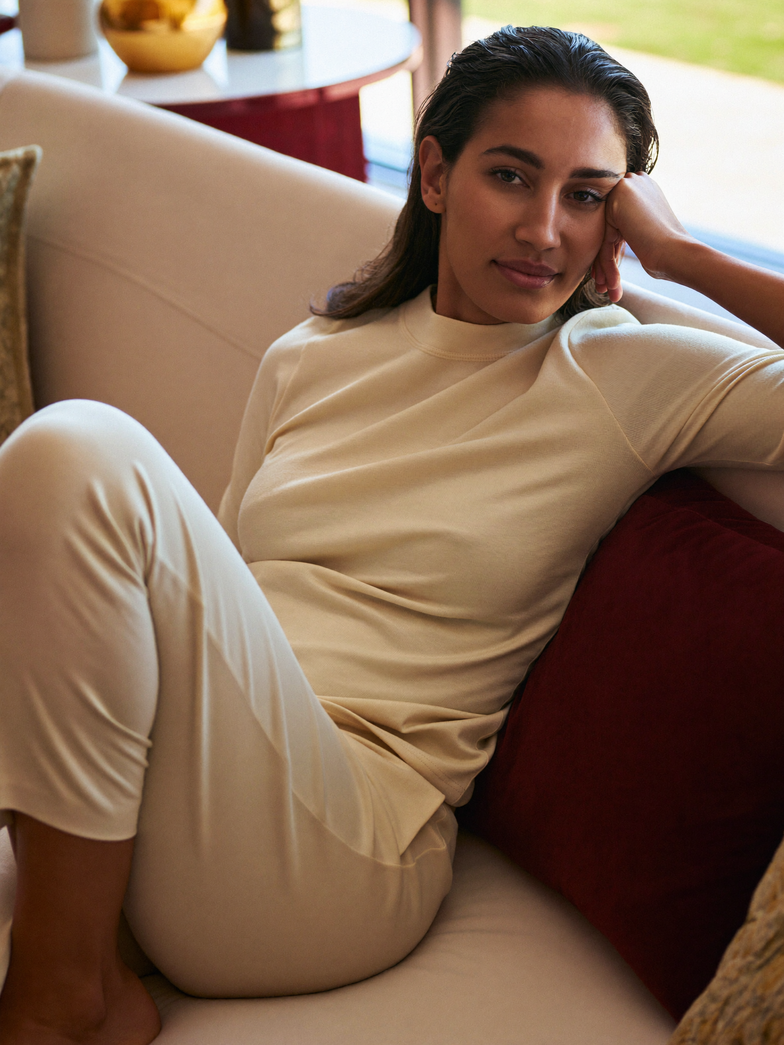 A woman resting calmly at home during a relaxed recovery